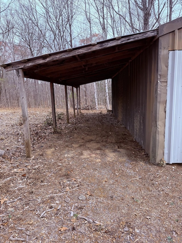 view of vehicle parking with a carport