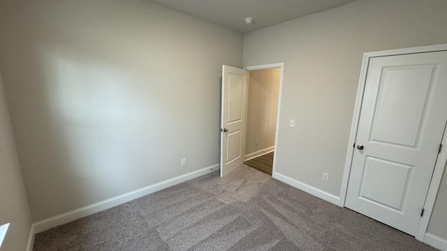 unfurnished bedroom with light colored carpet