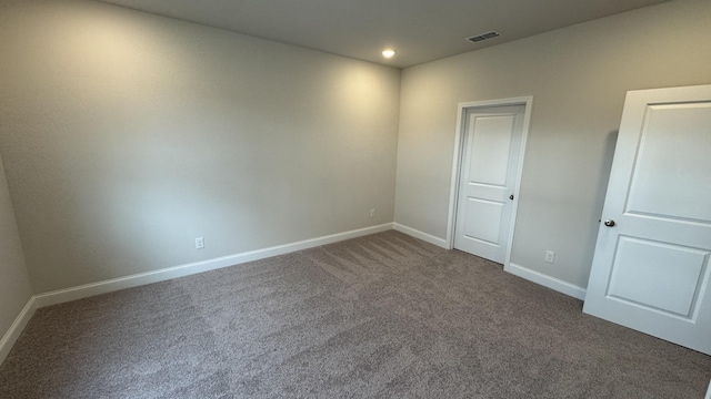 spare room featuring carpet