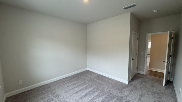 unfurnished room with carpet floors