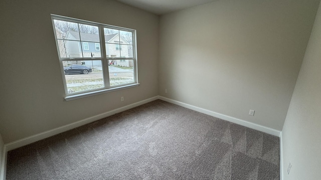 unfurnished room featuring carpet floors