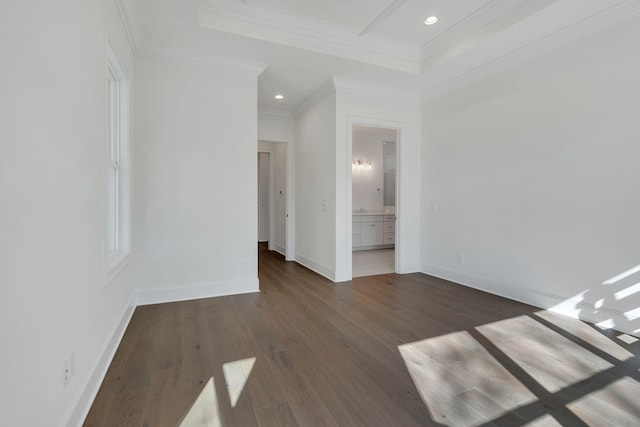 unfurnished bedroom featuring recessed lighting, wood finished floors, baseboards, ensuite bath, and crown molding