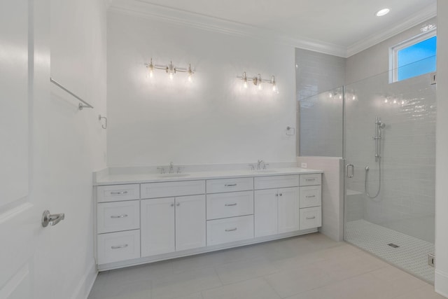 bathroom featuring double vanity, ornamental molding, a sink, and a shower stall