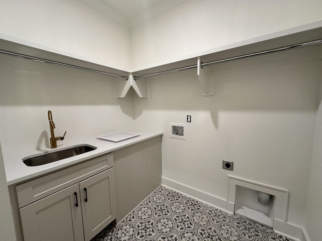 laundry room featuring hookup for an electric dryer, cabinets, sink, and washer hookup