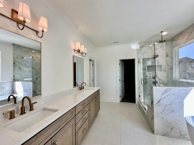 bathroom with crown molding, a sink, a marble finish shower, and double vanity