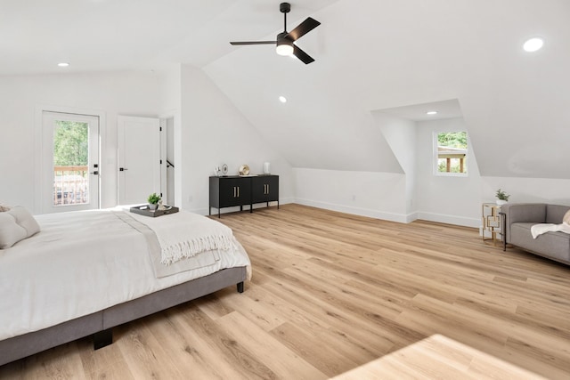 bedroom with access to outside, ceiling fan, vaulted ceiling, and hardwood / wood-style flooring