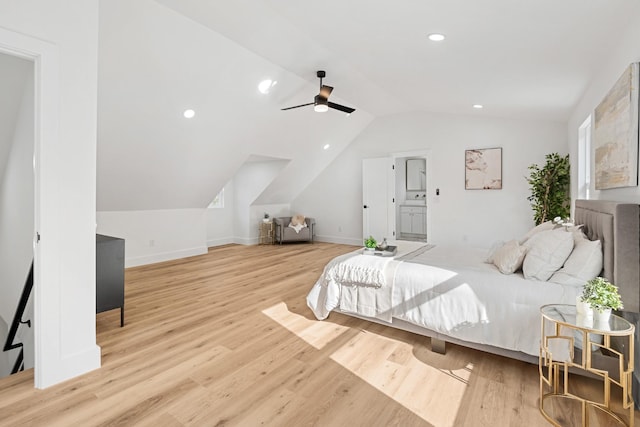 bedroom with light hardwood / wood-style floors, vaulted ceiling, and ceiling fan