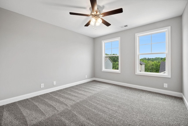 carpeted empty room with ceiling fan