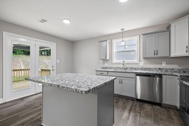 kitchen featuring sink, dishwasher, pendant lighting, and gray cabinets