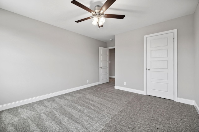 unfurnished bedroom with ceiling fan and carpet floors