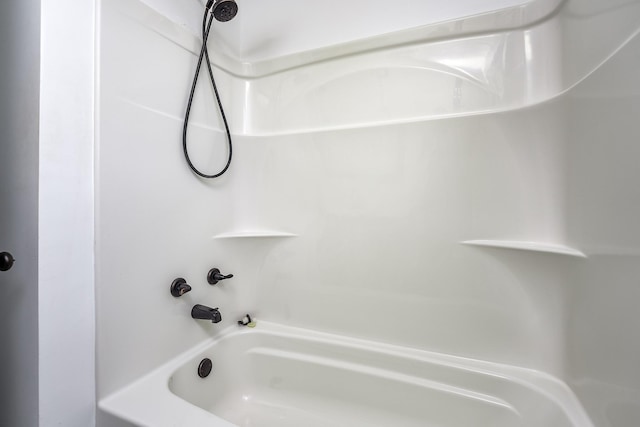 bathroom with shower / washtub combination