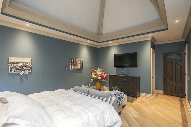 bedroom featuring crown molding and wood-type flooring