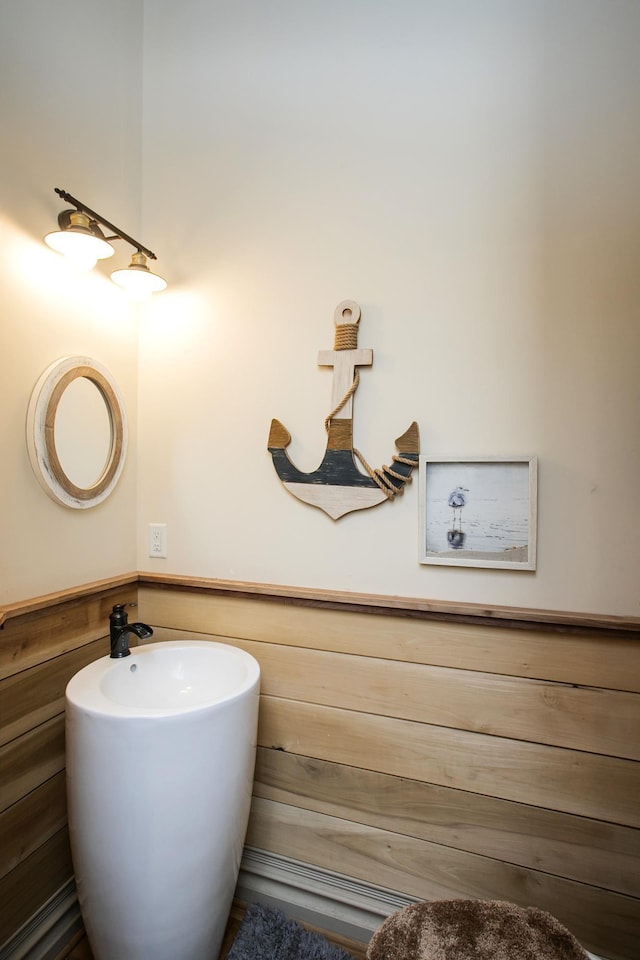 bathroom with wooden walls