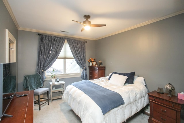 bedroom featuring crown molding, light colored carpet, and ceiling fan