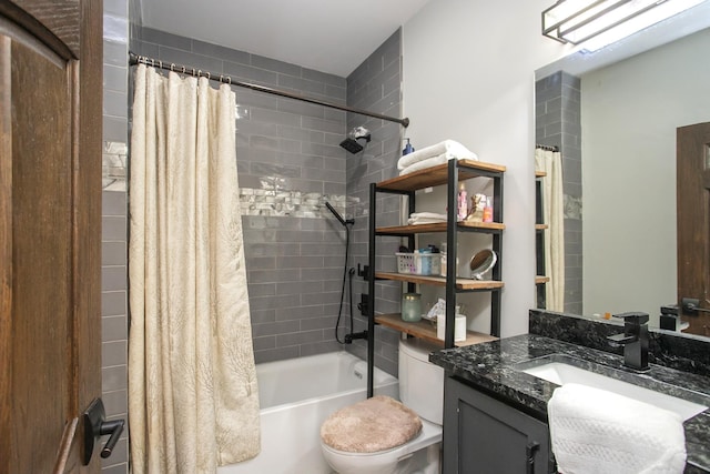 full bathroom with shower / tub combo with curtain, vanity, and toilet