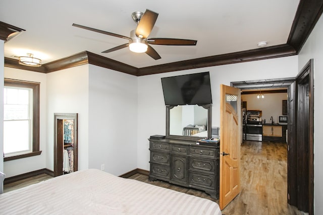 bedroom with crown molding and wood-type flooring