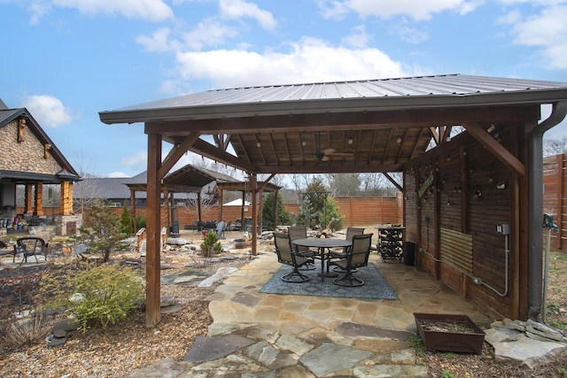 view of patio with a gazebo and ceiling fan