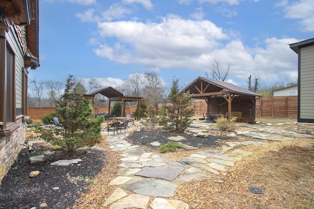 view of yard featuring a gazebo, a pergola, and a patio