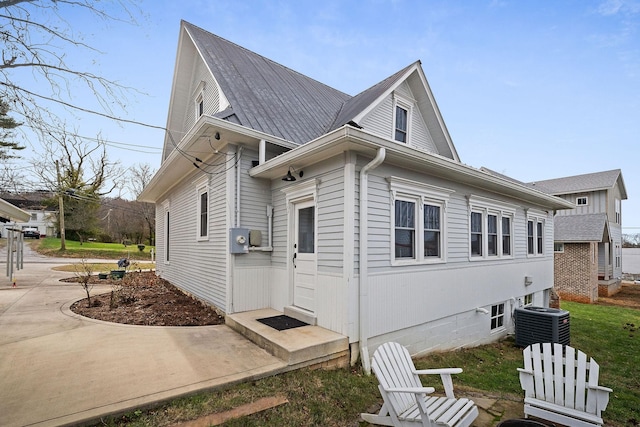 view of side of property with central AC