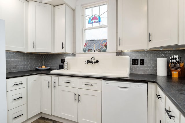 kitchen with decorative backsplash, white cabinetry, sink, and white dishwasher