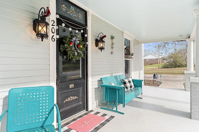 property entrance featuring covered porch