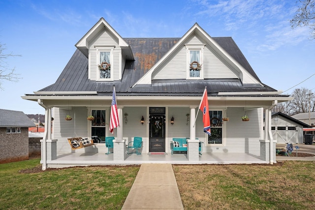 view of front of property with a porch and a front lawn