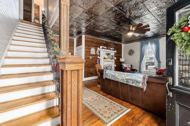 interior space with wood walls and dark hardwood / wood-style flooring