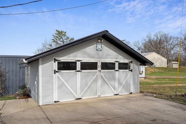 garage featuring a lawn