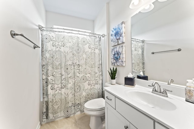 bathroom with tile patterned floors, walk in shower, vanity, and toilet