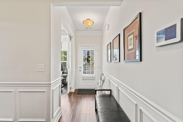 entryway with dark hardwood / wood-style floors and ornamental molding