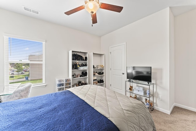 carpeted bedroom with ceiling fan