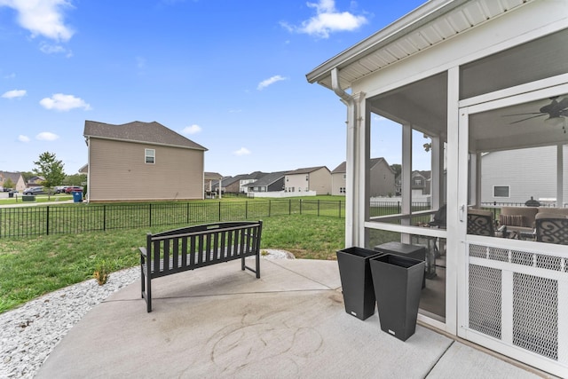 view of patio featuring a sunroom