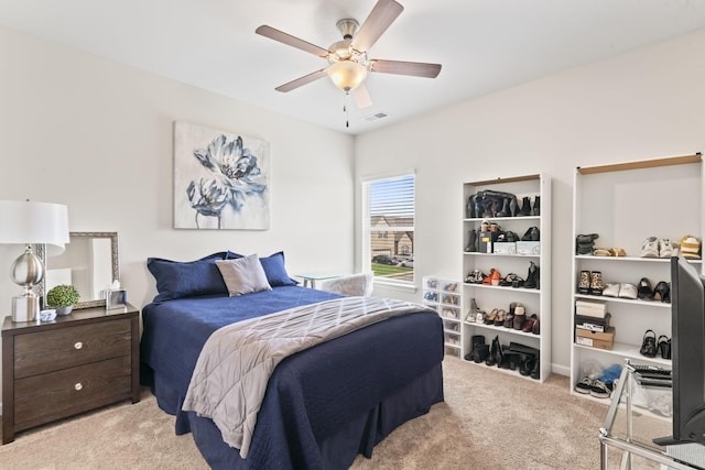 carpeted bedroom with ceiling fan