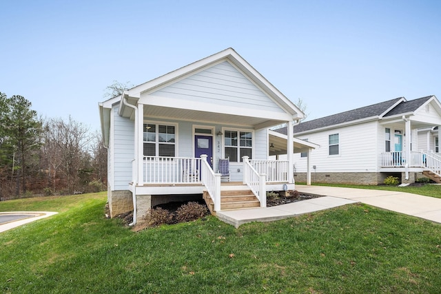 view of front of home with a porch and a front yard