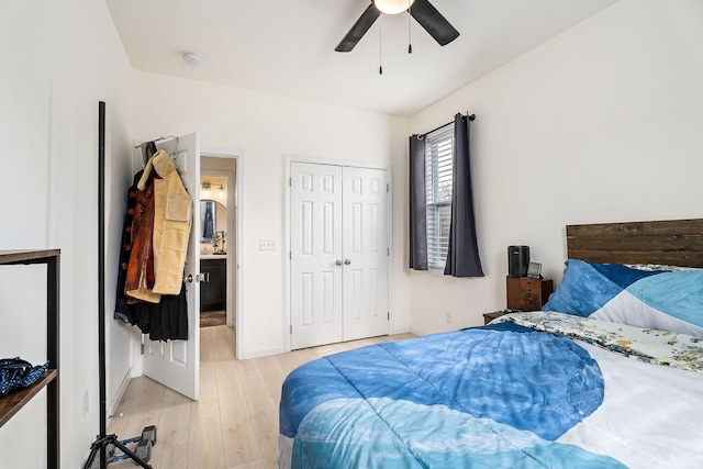 bedroom featuring light wood-type flooring, a closet, and ceiling fan