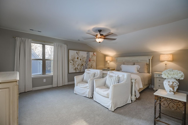 bedroom with ceiling fan, lofted ceiling, and light carpet