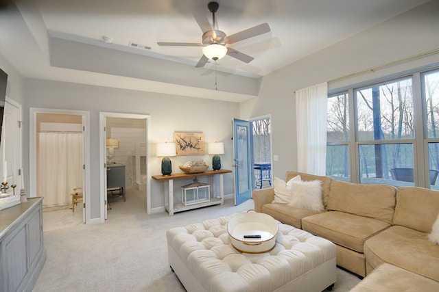 living room featuring light carpet and ceiling fan