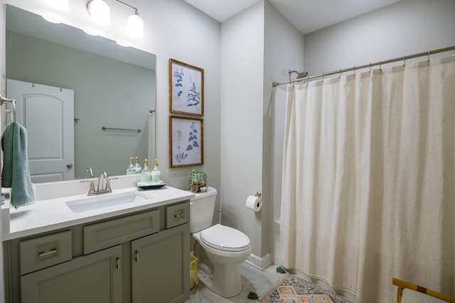 bathroom with vanity, a shower with shower curtain, and toilet