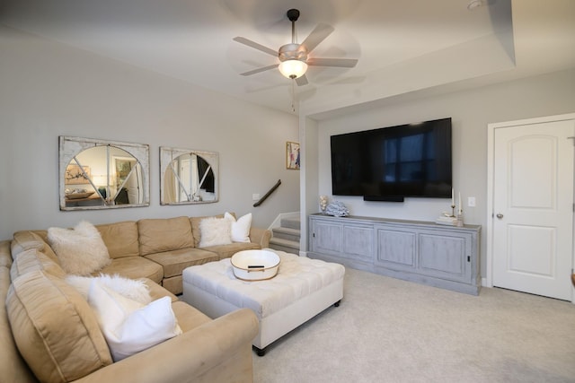 living room featuring light carpet and ceiling fan