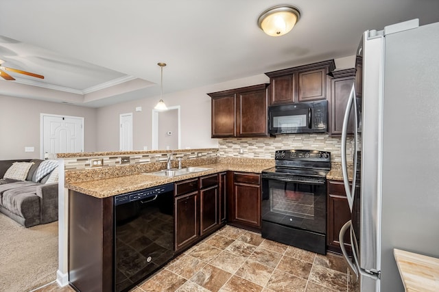 kitchen with backsplash, kitchen peninsula, sink, and black appliances