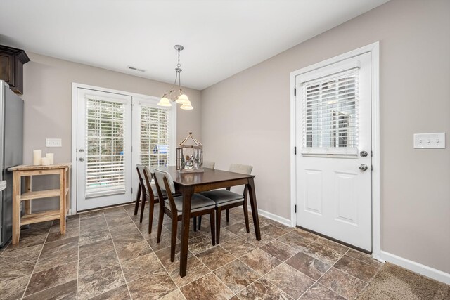 dining room featuring a notable chandelier