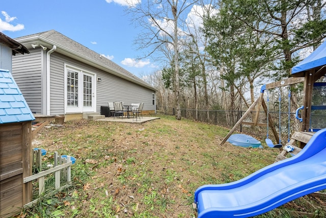 view of yard featuring a patio and a playground