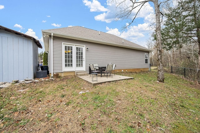 back of property featuring a patio and a lawn