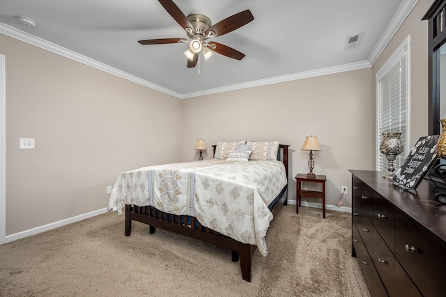 carpeted bedroom with ceiling fan and crown molding