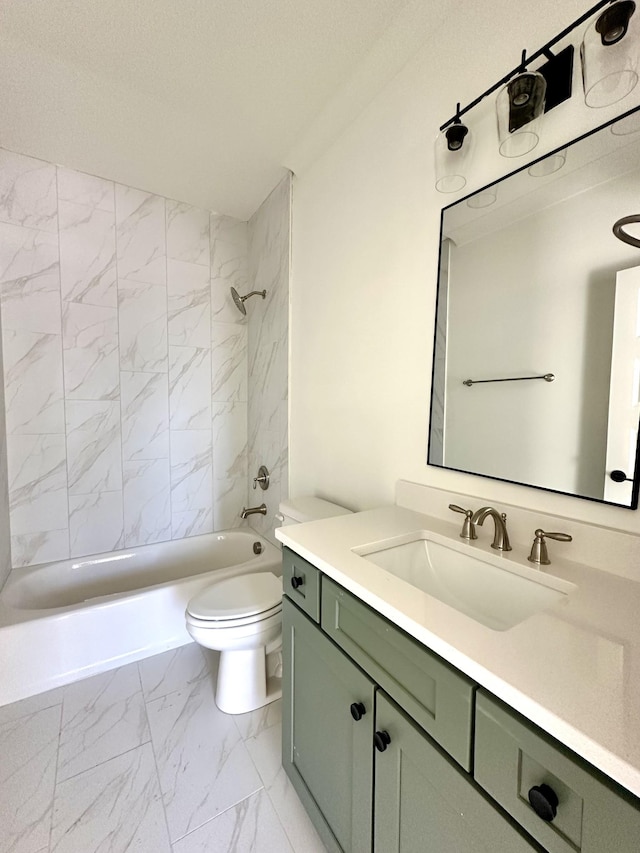 full bathroom featuring toilet, marble finish floor, bathtub / shower combination, and vanity