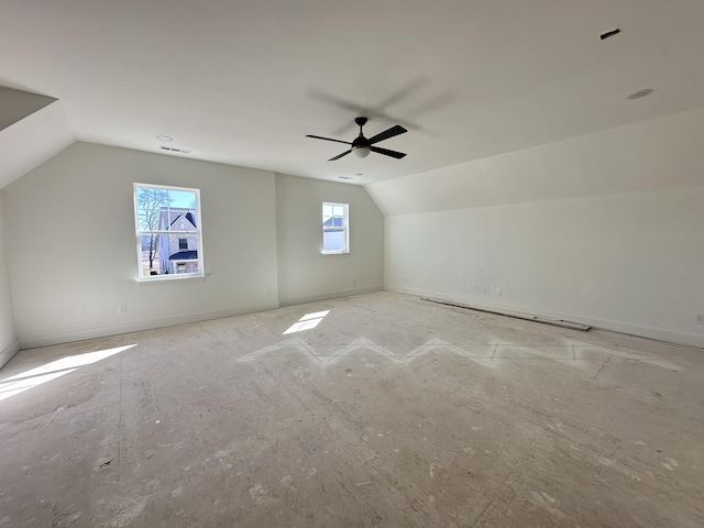 bonus room featuring lofted ceiling, visible vents, and a ceiling fan