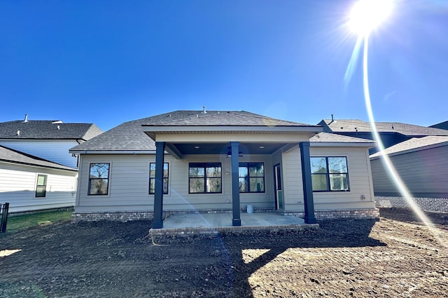 back of house featuring a patio area and ceiling fan