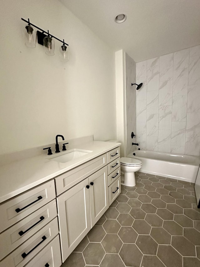 bathroom with washtub / shower combination, vanity, toilet, and tile patterned floors