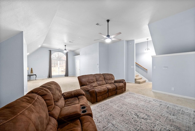 living room with ceiling fan, lofted ceiling, and light colored carpet