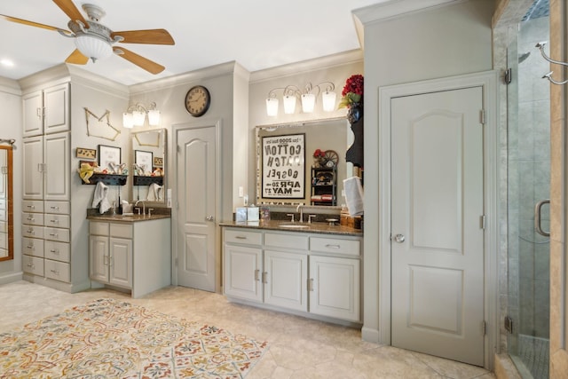 bathroom featuring vanity, walk in shower, ornamental molding, and ceiling fan